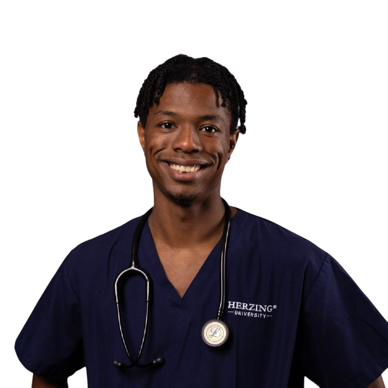 Smiling nurse in blue scrubs with a stethoscope, arms crossed